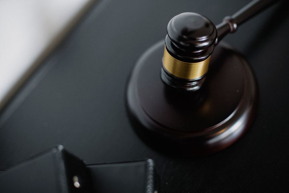 Wooden judge's gavel symbolizing justice and legal penalties