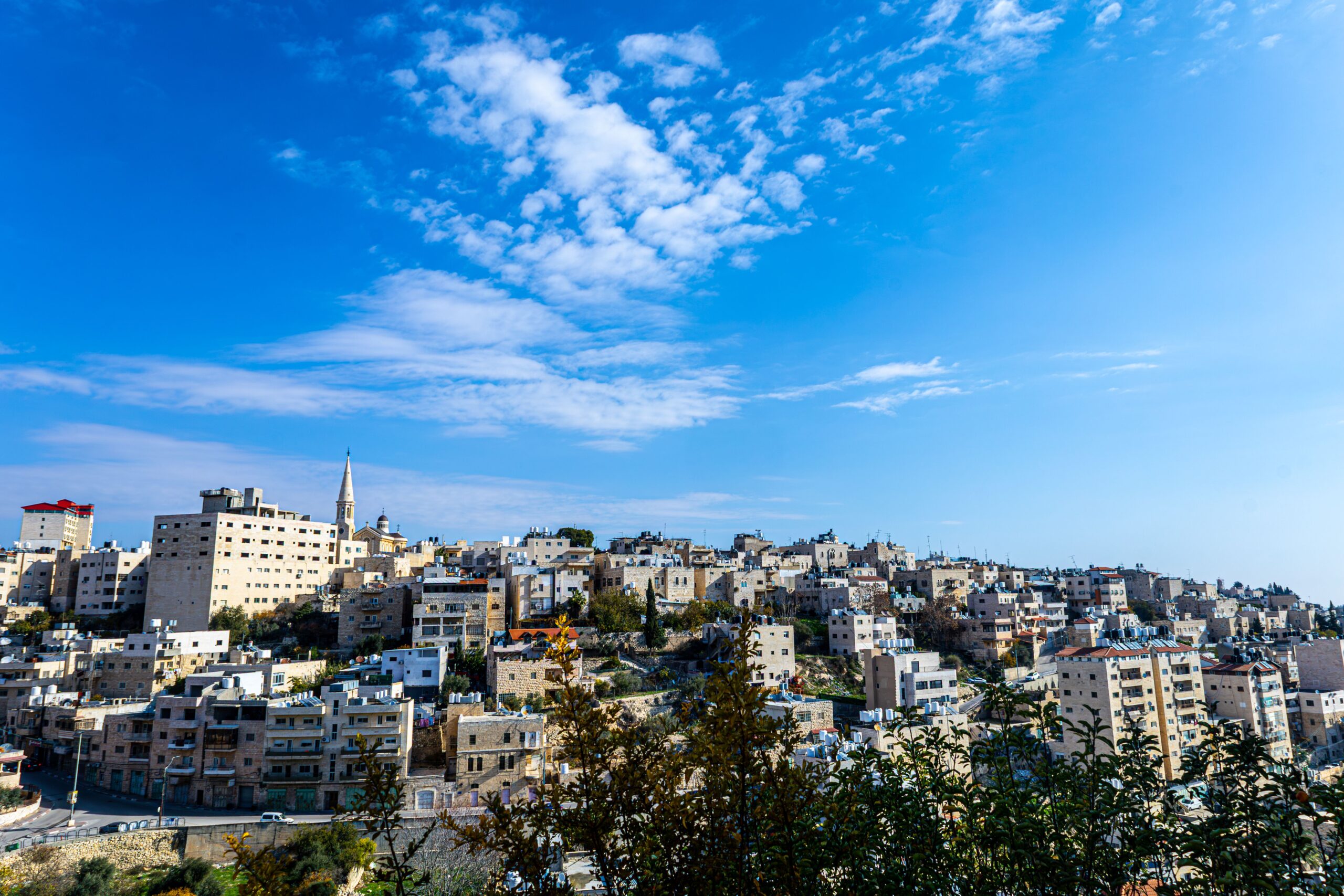 Panoramic view of the city of Bethlehem under a bright blue sky